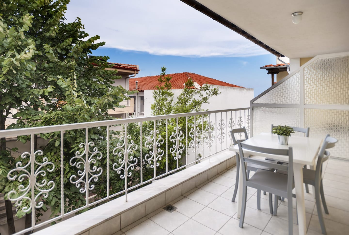 Balcony with table and view over the village roofs
